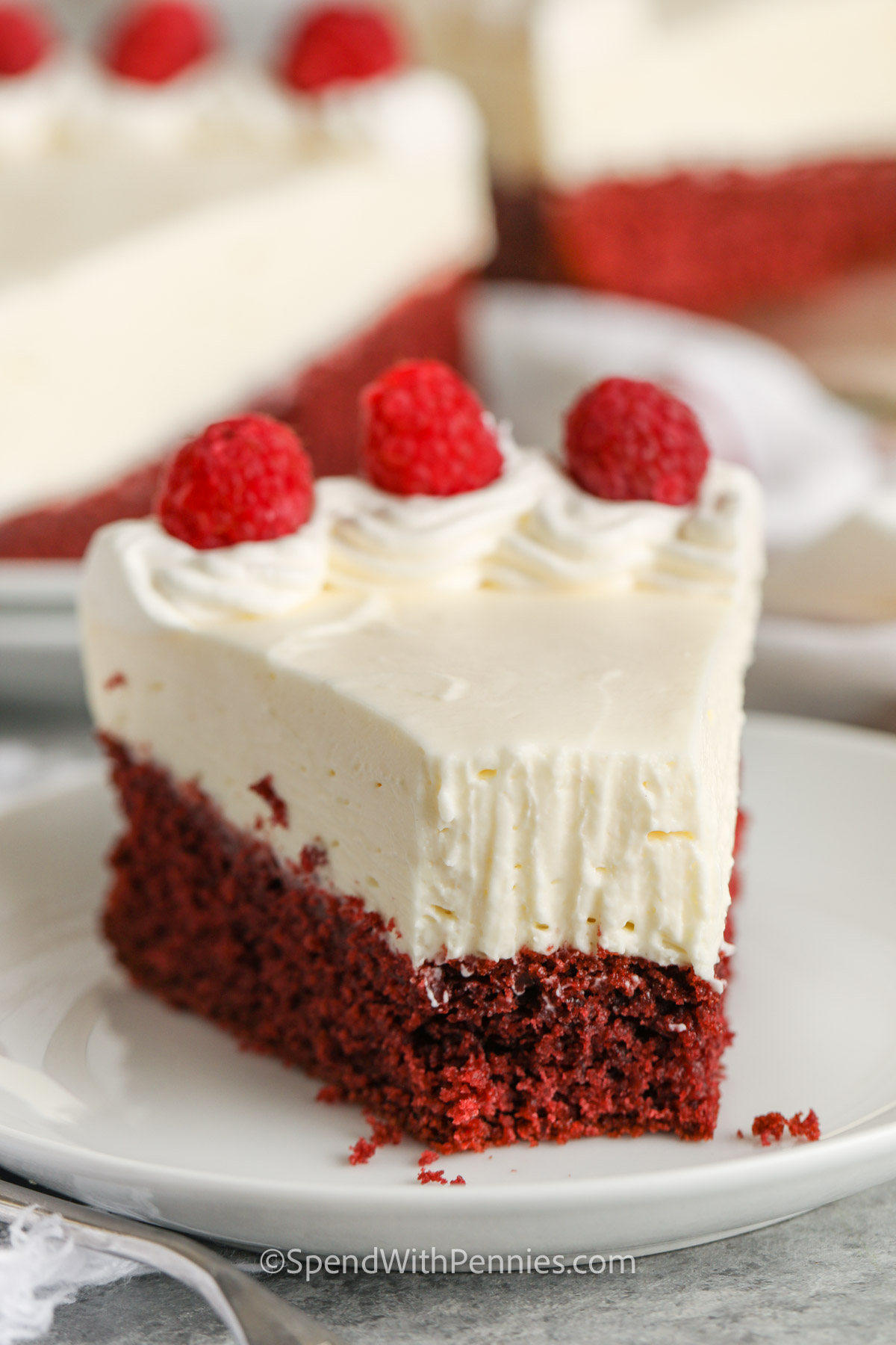 plated Easy Red Velvet Cheesecake with a bite taken out