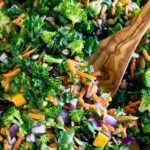 Easy Kale Salad in a bowl with a serving spoon